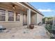 Covered back patio with flagstone and views of desert landscape at 18391 W Verdin Rd, Goodyear, AZ 85338