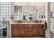 Bathroom with double sink vanity and a spacious walk-in closet at 18391 W Verdin Rd, Goodyear, AZ 85338