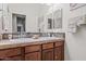 Bathroom features a double sink vanity and neutral-colored tile flooring at 18391 W Verdin Rd, Goodyear, AZ 85338