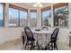Charming breakfast nook with bay windows offering scenic views and a cozy dining setup at 18391 W Verdin Rd, Goodyear, AZ 85338