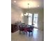 Bright dining area with a chandelier above a poker table and built in cabinets at 18391 W Verdin Rd, Goodyear, AZ 85338