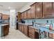 Well-appointed kitchen with granite countertops, stainless steel appliances, and custom cabinets at 18391 W Verdin Rd, Goodyear, AZ 85338