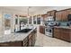 Gourmet kitchen featuring granite counters, stainless steel appliances, and a large center island at 18391 W Verdin Rd, Goodyear, AZ 85338