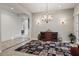 Elegant room with tiled floors, a stylish sideboard and neutral wall colors at 18391 W Verdin Rd, Goodyear, AZ 85338