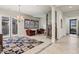 Inviting living room with tiled floors, plantation shutters, and stylish furnishings at 18391 W Verdin Rd, Goodyear, AZ 85338