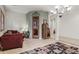 Spacious living room with a cozy seating arrangement and a glimpse of the wine cellar at 18391 W Verdin Rd, Goodyear, AZ 85338