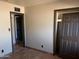 Bedroom featuring neutral walls, tile floors, and a closet at 1858 N Hibbert Cir, Mesa, AZ 85201