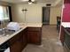 Kitchen featuring dark cabinets, stainless steel appliances, and updated countertops at 1858 N Hibbert Cir, Mesa, AZ 85201