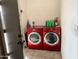 A dedicated laundry room featuring a modern washer and dryer at 1858 N Hibbert Cir, Mesa, AZ 85201