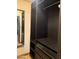 An organized walk-in closet featuring dark wood shelving, drawers and chrome hardware at 1858 N Hibbert Cir, Mesa, AZ 85201
