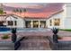 Charming home's backyard features a refreshing pool, brick patio, and scenic view of the property at 2043 E Clipper Ln, Gilbert, AZ 85234