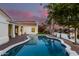 Backyard featuring a waterfront view with a well-manicured lawn, pool, and spa at 2043 E Clipper Ln, Gilbert, AZ 85234
