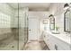 Modern bathroom featuring a glass shower, dual sink vanity, and stylish tile flooring at 2043 E Clipper Ln, Gilbert, AZ 85234