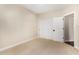 Light filled bedroom with ample space, neutral walls, and carpeted flooring and closet at 2043 E Clipper Ln, Gilbert, AZ 85234