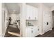 Butler pantry with counter space, white cabinetry, and easy access to the living area at 2043 E Clipper Ln, Gilbert, AZ 85234
