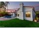 Beautiful home exterior with a red tile roof, well-manicured lawn, and a sparkling backyard pool at 2043 E Clipper Ln, Gilbert, AZ 85234