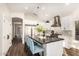 Modern kitchen with stainless steel appliances, white cabinetry, and an island with seating at 2043 E Clipper Ln, Gilbert, AZ 85234