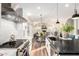 Spacious open-concept kitchen featuring a large island, modern appliances, and a view into the living area at 2043 E Clipper Ln, Gilbert, AZ 85234