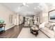 Bright and airy living room boasts modern furniture, dark hardwood floors, and an open floor plan at 2043 E Clipper Ln, Gilbert, AZ 85234