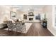 Inviting living room with fireplace, vaulted ceilings, wood floors, and natural light at 2043 E Clipper Ln, Gilbert, AZ 85234