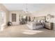 Bright and airy main bedroom with a bay window seating area, carpet floors and neutral colors at 2043 E Clipper Ln, Gilbert, AZ 85234