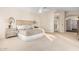 Spacious main bedroom featuring carpet, a headboard, and doorway to the bathroom at 2043 E Clipper Ln, Gilbert, AZ 85234