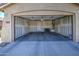 Spacious, unfinished two-car garage with painted walls and concrete flooring, ready for customization at 2133 W Gold Dust Ave, San Tan Valley, AZ 85144