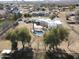 Aerial view of backyard pool and patio area, surrounded by mature trees, offering a private retreat at 22236 E Nacoma --, Queen Creek, AZ 85142