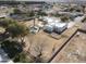 Expansive aerial view of white adobe home, pool and desert landscaping in sunny climate at 22236 E Nacoma --, Queen Creek, AZ 85142