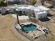 Aerial view of the property showcases the pool with a slide and outdoor firepit at 22236 E Nacoma --, Queen Creek, AZ 85142