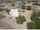 Expansive aerial view of white adobe home, pool and desert landscaping at 22236 E Nacoma --, Queen Creek, AZ 85142