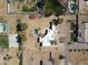 Bird's eye view of white adobe home, pool and desert landscaping in quiet neighborhood at 22236 E Nacoma --, Queen Creek, AZ 85142