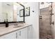 Bathroom features a tiled shower, granite countertop, and custom mirrors at 22236 E Nacoma --, Queen Creek, AZ 85142