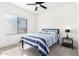 Comfortable bedroom with a ceiling fan, window, and a queen-size bed, providing a cozy and serene retreat at 22236 E Nacoma --, Queen Creek, AZ 85142