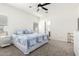 Bright bedroom with a ceiling fan, carpet, and a comfortable bed at 22236 E Nacoma --, Queen Creek, AZ 85142
