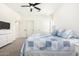 Bedroom featuring carpet, ceiling fan, and ample closet space at 22236 E Nacoma --, Queen Creek, AZ 85142