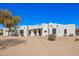 Charming single-story home featuring a custom adobe design and desert landscaping at 22236 E Nacoma --, Queen Creek, AZ 85142