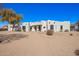 Stunning single-story home featuring a custom adobe design and desert landscaping at 22236 E Nacoma --, Queen Creek, AZ 85142