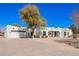 Front exterior view of a well-maintained desert home with a driveway and minimal landscaping at 22236 E Nacoma --, Queen Creek, AZ 85142