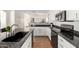 Updated kitchen featuring granite countertops, stainless steel appliances, and white cabinets at 22236 E Nacoma --, Queen Creek, AZ 85142