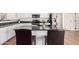 Kitchen island with breakfast bar, granite counters and stainless steel appliances at 22236 E Nacoma --, Queen Creek, AZ 85142
