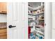 Walk-in pantry features ample shelving for organization at 22236 E Nacoma --, Queen Creek, AZ 85142