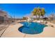 Sparkling backyard pool and slide with surrounding patio and mature trees at 22236 E Nacoma --, Queen Creek, AZ 85142