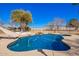 Beautiful backyard pool with slide, rock feature, and mature landscaping at 22236 E Nacoma --, Queen Creek, AZ 85142