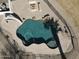 Aerial view of a freeform pool with slide and a firepit surrounded by decorative rock at 22236 E Nacoma --, Queen Creek, AZ 85142