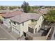 Aerial view of a two-story home highlighting a private backyard with a water feature and a desert landscape at 2568 E Boston St, Gilbert, AZ 85295