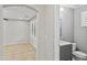 Bathroom featuring a gray vanity, toilet, and light fixtures at 2568 E Boston St, Gilbert, AZ 85295