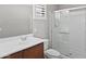 Bathroom showcasing a glass door shower, single sink vanity, and ample natural light at 2568 E Boston St, Gilbert, AZ 85295