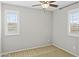 Neutral bedroom with dual windows, tan carpet and plenty of natural light at 2568 E Boston St, Gilbert, AZ 85295