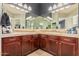 Bathroom with double vanity, tiled countertop and backsplash, and recessed lighting at 28798 N 127Th Ave, Peoria, AZ 85383